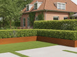 Stützmauer aus Cortenstahl im Gartenbeet neben Haus